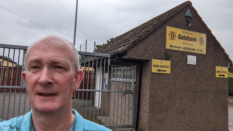 Self portait photo in front of the entrance gates at the Annan Athletic Football Club ground